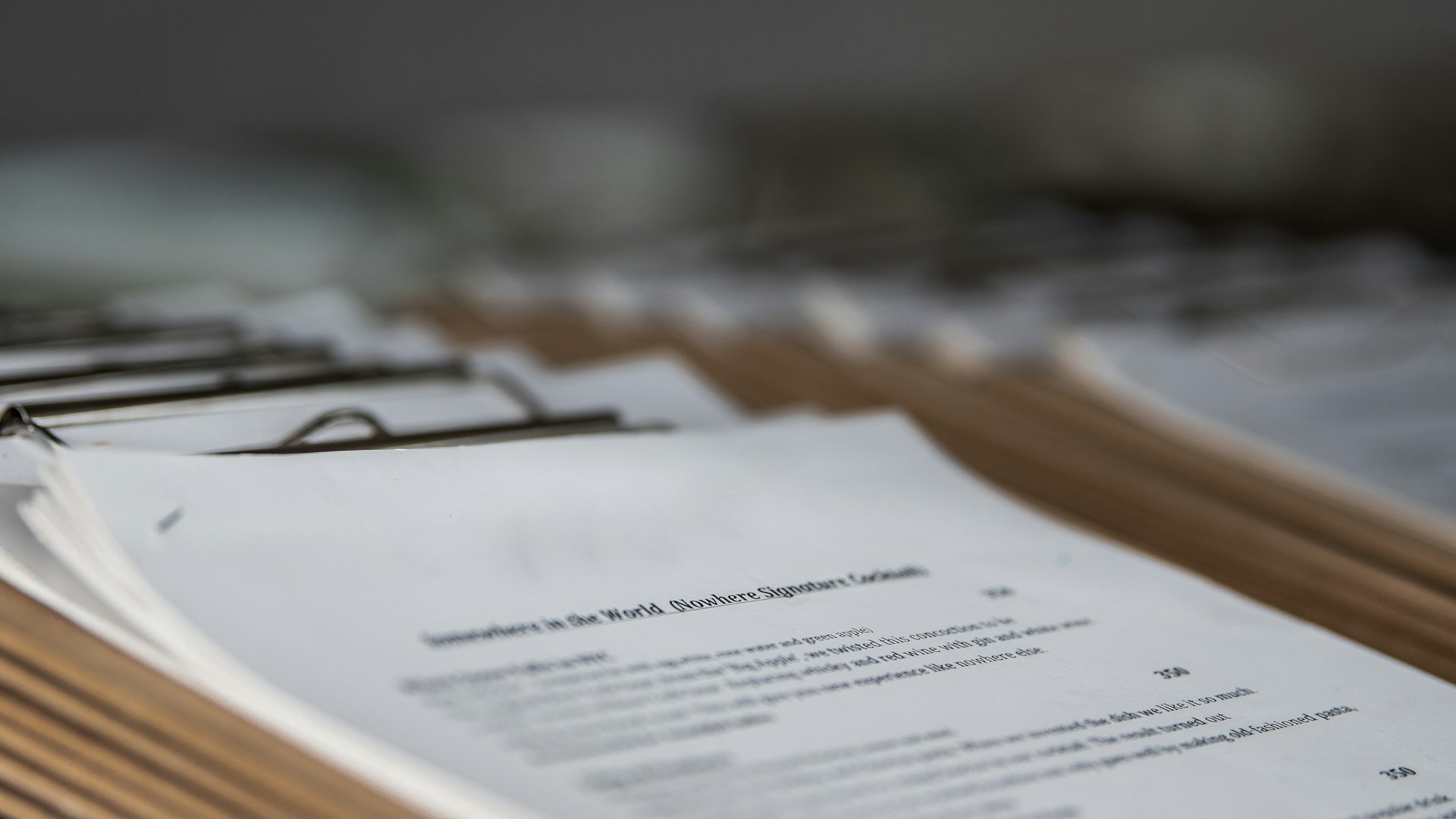 restaurant menus on clipboards close up
